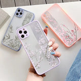 a woman holding a phone case with a flower design