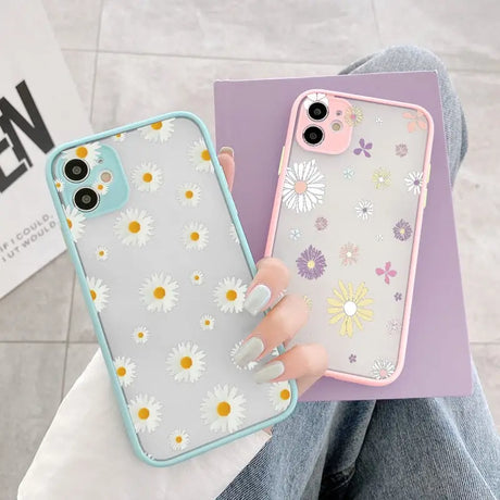 A woman holding a phone case with flowers on it