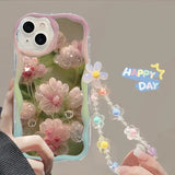 a woman holding a phone case with flowers