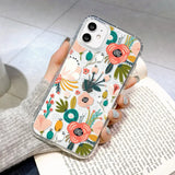 a woman holding a phone case with flowers on it