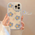 A woman holding a phone case with flowers on it