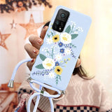 a woman holding a phone case with flowers on it