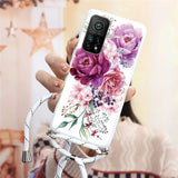 a woman holding a phone case with flowers on it