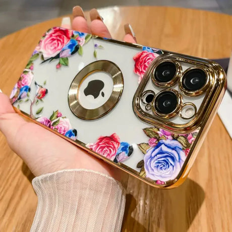 a woman holding a phone case with flowers on it