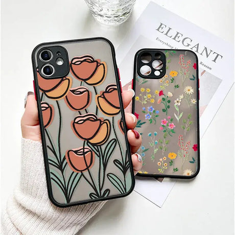 A woman holding a phone case with flowers on it