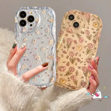 A woman holding a phone case with flowers on it