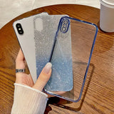 a woman holding a phone case with glitter on it