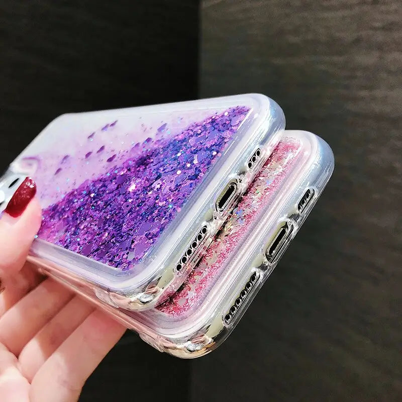 a woman holding a phone case with glitter on it