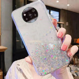 a woman holding a phone case with glitter