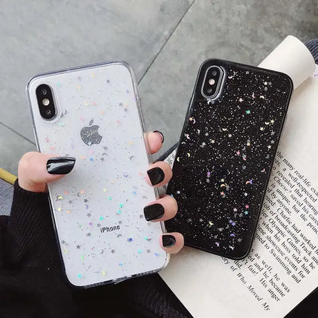 A woman holding a phone case with glitter stars on it