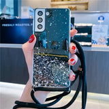 A woman holding a phone case with glitter on it