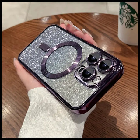 A woman holding a phone case with a glitter phone cover