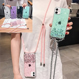 a woman holding a phone case with glitter and stripes