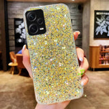 a woman holding a phone case with glitter
