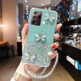 a woman holding a phone case with a green glitter phone cover