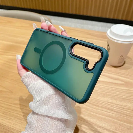 A woman holding a phone case with a green lens