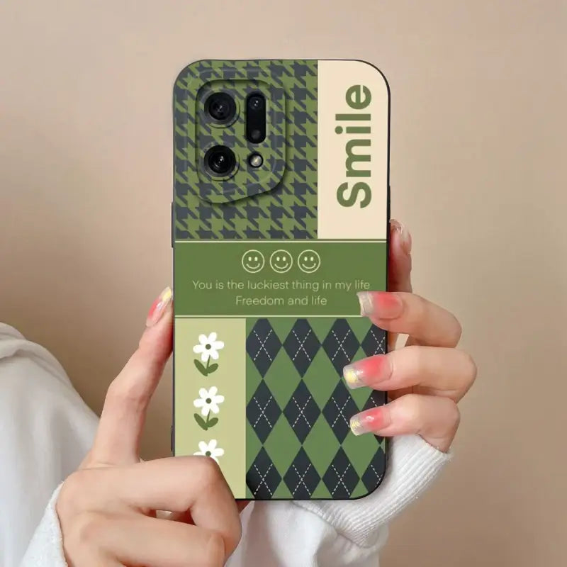 a woman holding a phone case with a green argyle pattern