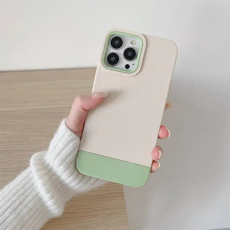 a woman holding a phone case with a green color