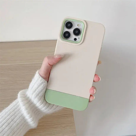 A woman holding a phone case with a green color