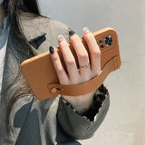 a woman holding a phone case in her hand