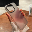 A woman holding a phone case with a phone in her hand