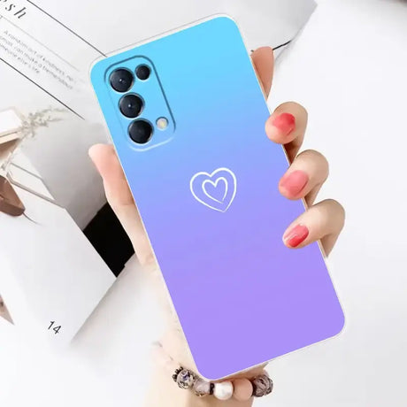 A woman holding a phone case with a heart on it