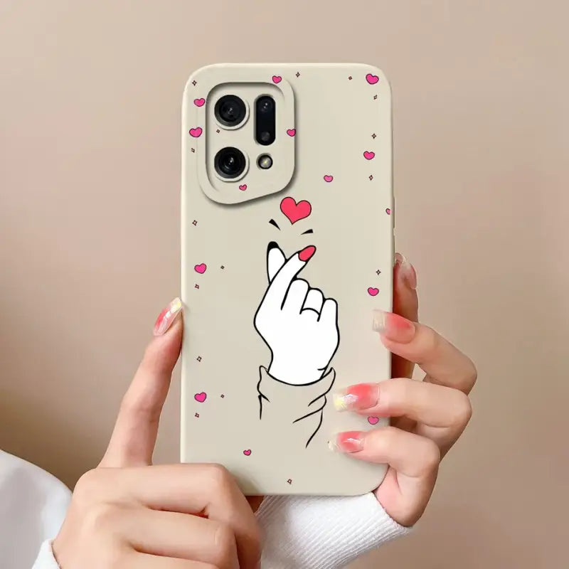 a woman holding a phone case with a heart on it