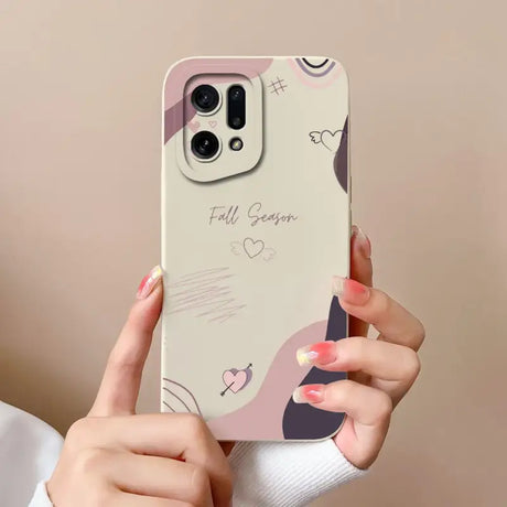 a woman holding a phone case with a heart design