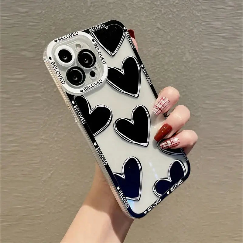 a woman holding a phone case with a heart pattern