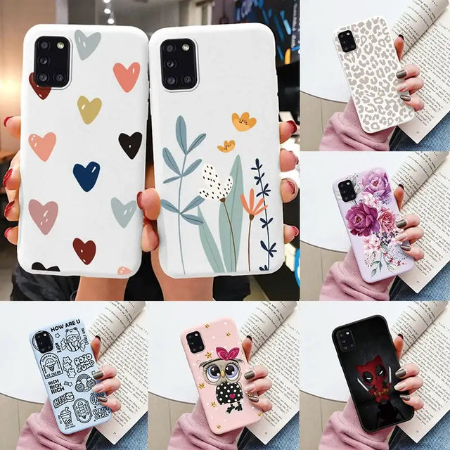 a woman holding a phone case with hearts and flowers
