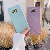 a woman holding a phone case with a phone holder