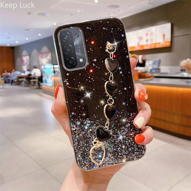 a woman holding up a phone case with a phone holder