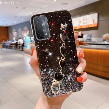 a woman holding up a phone case with a phone holder