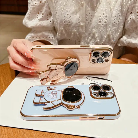A woman holding a phone case with a phone holder