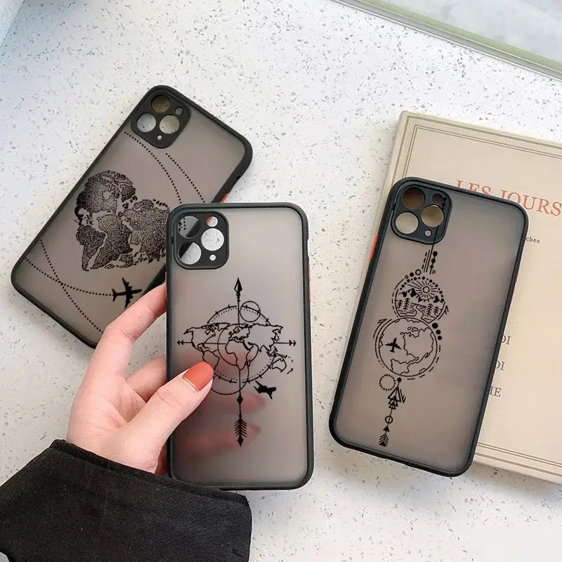 a woman holding a phone case with a drawing on it