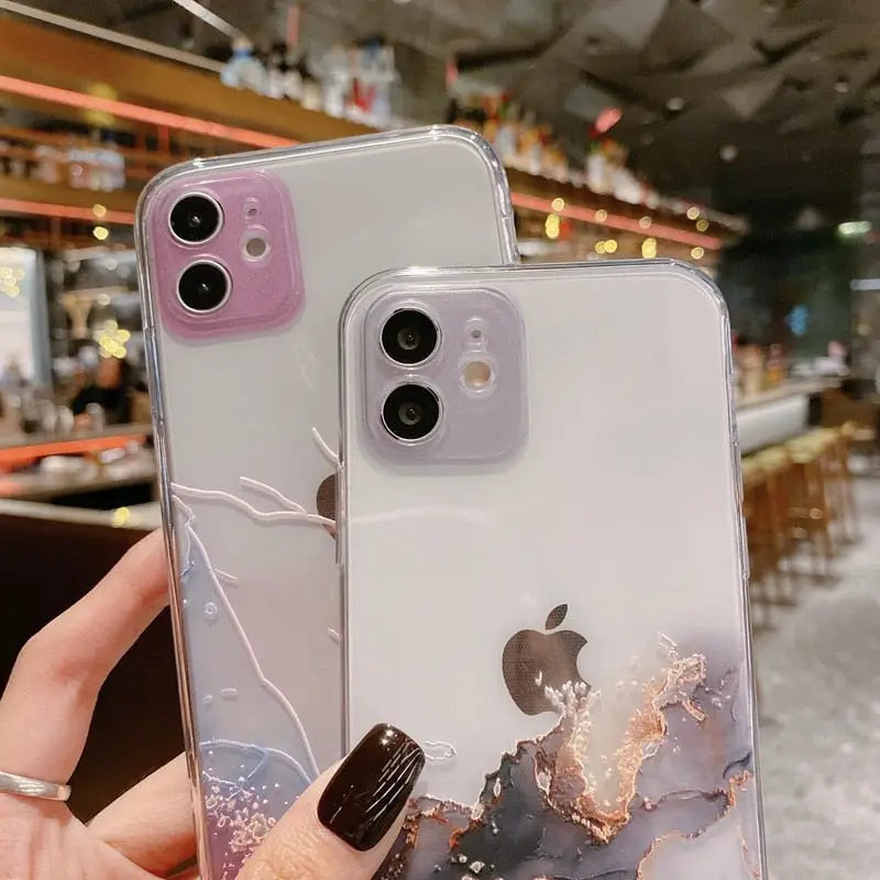a woman holding a phone case with a marble marble pattern