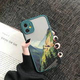 a woman holding a phone case with a painting of a mountain scene