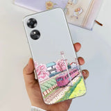 a woman holding a phone case with a painting of a train
