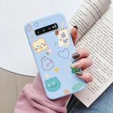 a woman holding a phone case with a pattern of animals and birds