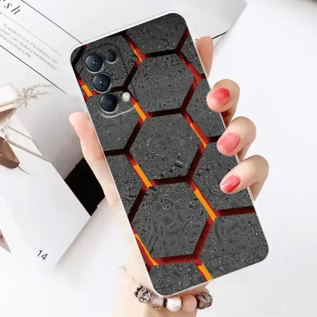 A woman holding a phone case with a pattern on it