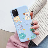 a woman holding a phone case with a pattern of animals and fish