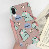 a woman holding a phone case with a pattern of cats