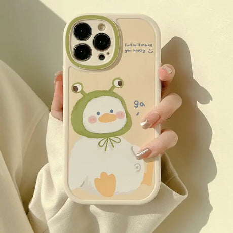 A woman holding a phone case with a penguin on it