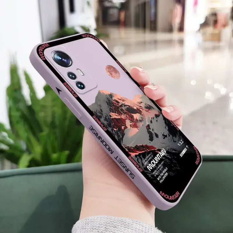 A woman holding a phone case with a picture of a girl