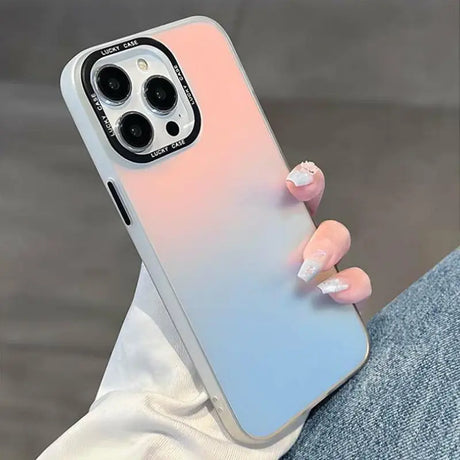 a woman holding a phone case with a pink and blue gradient design
