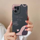 a woman holding a phone case with a pink and black design