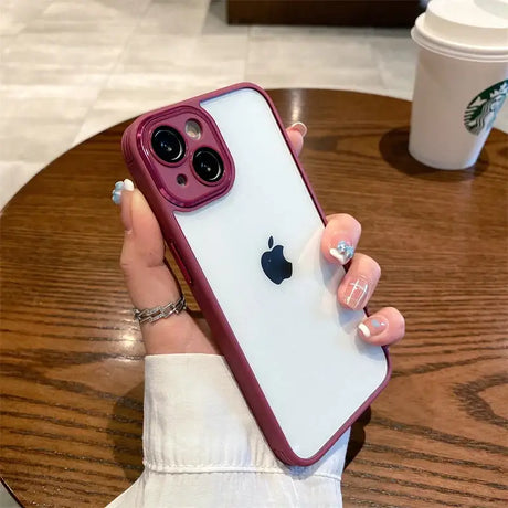 A woman holding a phone case with a pink iphone