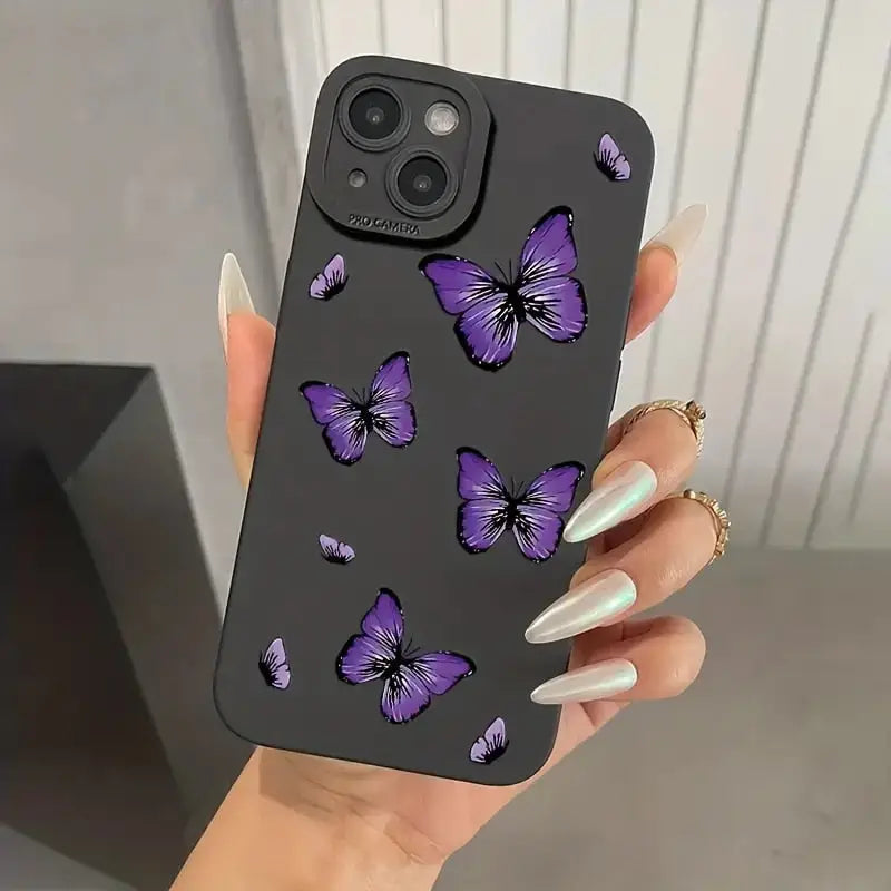 A woman holding a phone case with purple butterflies on it