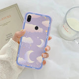 a woman holding a phone case with a purple and white pattern