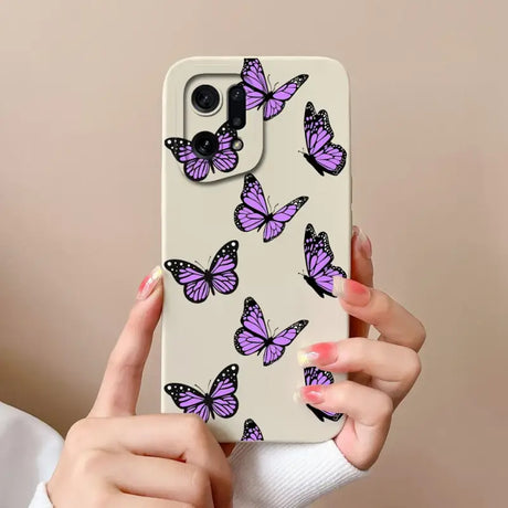 a woman holding a phone case with purple butterflies on it